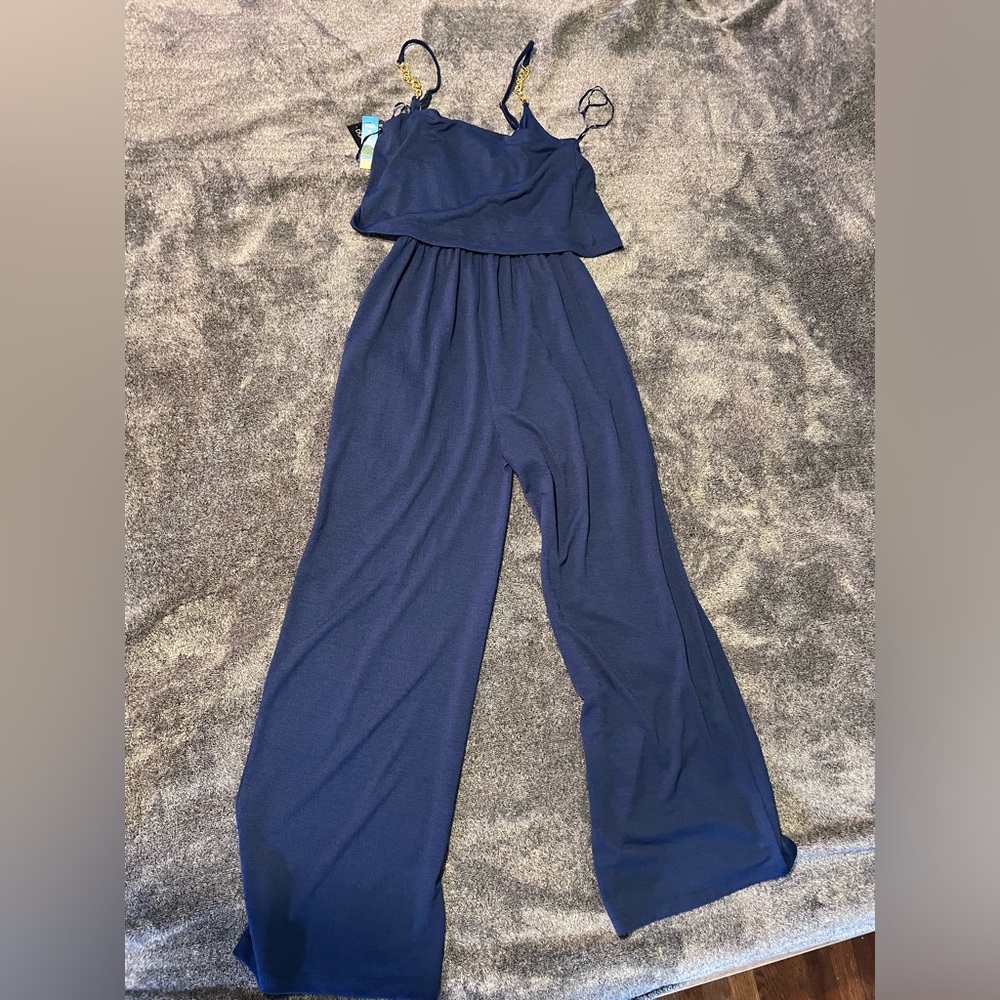 Navy Arianna Jumpsuit with gold chain accents on the straps